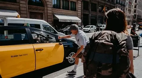 Rideshare passenger exiting a taxi